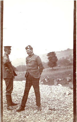 Photograph of T.H. Raddall, Sr., with another uniformed officer on or near Reach Field in Hythe, ...