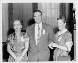 Photograph of an unidentified female, C.D. Bishop and M.B. MacKay at annual meeting