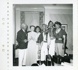 Photograph of Thomas Head Raddall with the singing quartet The Privateers and an unidentified woman