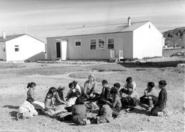 Photograph of a class being held outdoors in Cape Dorset, Northwest Territories