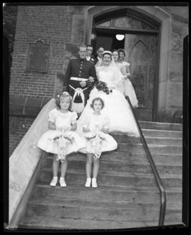 Photograph of Mr. & Mrs. Leil and the flower girls standing on the steps of the Church