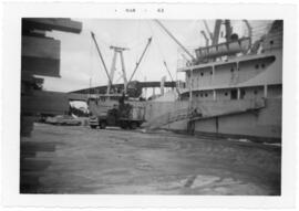 Photograph of an unidentified Pulp Ship loading lumber at the East River Dock, Sheet Harbour
