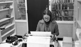 Photograph of Paddy Burt working at the Killam Library, Dalhousie University