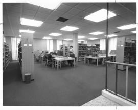 Photograph of work tables and book shelves in the Sir James Dunn Law Library