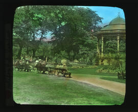 Photograph of people sitting on benches near the bandstand in the Halifax Public Gardens
