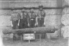 Photograph of four boy scouts with a gun from Louisbourg