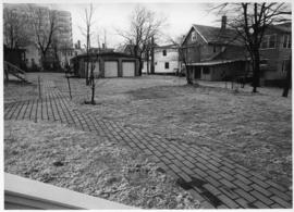 Photograph of a lawn between department houses
