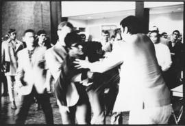 Photograph of the newly formed Campus Police forcibly removing a member of a Maoist group trying ...