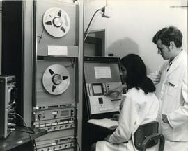 Photograph of Dr. I. Valimaki and a computer operator in the Medical Computer Centre