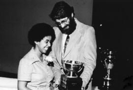 Photograph of Julie West and Dr. Michael J. Ellis : Class of '55 Trophy presentation