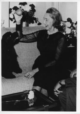Photograph of Dorothy Johnston Killam playing with a dog