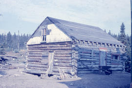 Photograph of a log cabin used by the Oblate mission in Davis Inlet, Newfoundland and Labrador