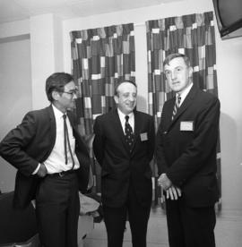 Photograph of three people at an event for the Dalhousie medical centennial