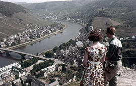 Photograph of two unidentified people looking over Cochem
