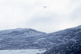 Photograph of an RCMP airplane arriving in Cape Dorset, Northwest Territories