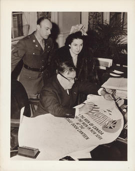 Photograph of Ellen Ballon, Fiorello H. LaGuardia, and unidentified man in uniform