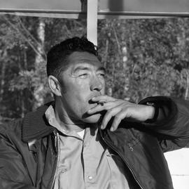 Photograph of Dick Field smoking a cigarette
