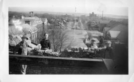 Photograph of men working on a stone wall on the Arts & Administration Building