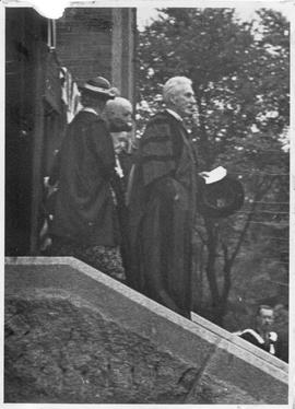 Photograph of A. S. MacKenzie and others on the front steps of the Forrest Building