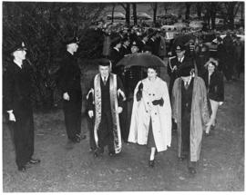 Photograph of Dr. Kerr, Princess Elizabeth, and Colonel Laurie walking past naval cadets