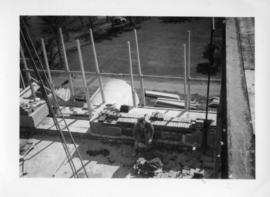 Photograph of a bricklayer on the Arts & Administration Building construction site