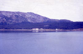 Photograph of a house on the shore of Davis Inlet, Newfoundland and Labrador