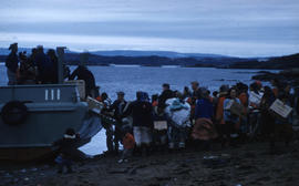 Photograph of packages being unloaded from a boat in Frobisher Bay, Northwest Territories