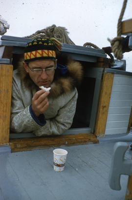 Photograph of Bob Green on a boat in Frobisher Bay, Northwest Territories