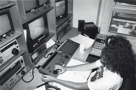 Photograph of person in editing suite