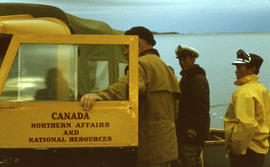 Photograph of three men and a truck in Frobisher Bay, Northwest Territories