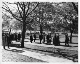 Photograph of scientists and distinguished guests walking outside