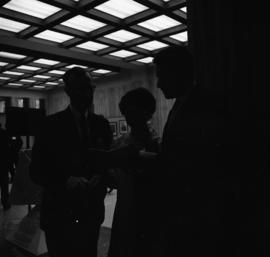 Photograph of three unidentified people in the Tupper Building