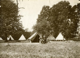 Two officers in front of the tents