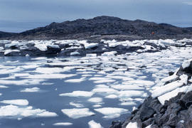 Photograph of ice floes and hills in Frobisher Bay