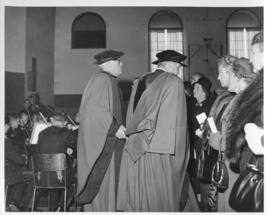 Photograph of two unidentified people in robes