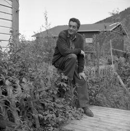 Photograph of Black Douglas Jackson sitting on a fence