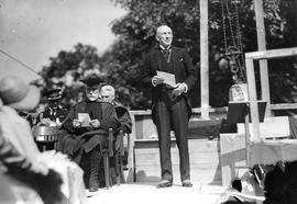 Photograph of Hon. E. N. Rhodes speaking to a crowd