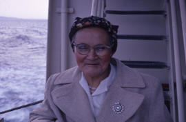 Photograph of a woman wearing glasses and a tan coat in Newfoundland and Labrador