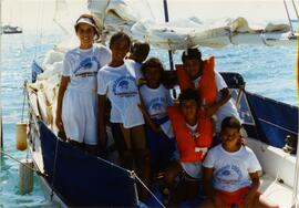 Photograph of Gloria Zuleta Rodriguez with kids from a summer camp