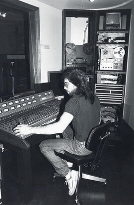 Photograph of person in audio suite