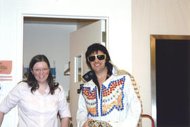 Photograph of Librarian Shelley McKibbon and Elvis impersonator smiling