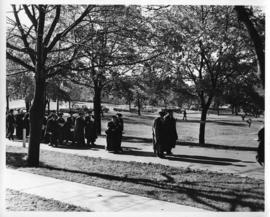 Photograph of scientists and distinguished guests walking outside