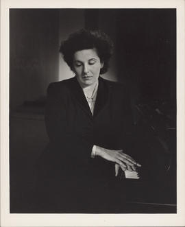 Photograph of Ellen Ballon with a piano