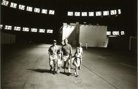Photograph of a family walking inside a large building