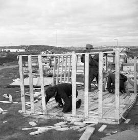 Photograph of children building a playhouse in Fort Chimo, Quebec
