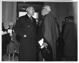 Photograph of two unidentified people in conversation