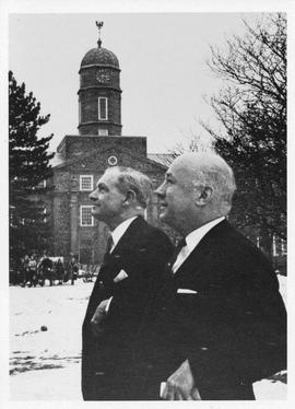 Photograph of Donald McInnes and Henry Hicks in front of the Henry Hicks Academic Administration ...