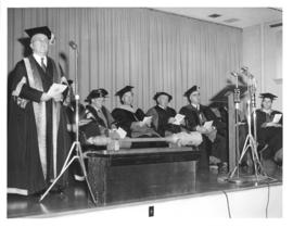 Photograph of A. E. Kerr, C. D. Howe, and others on stage
