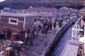 Photograph of a crowd of people on a dock watching a ship in Nain, Newfoundland and Labrador