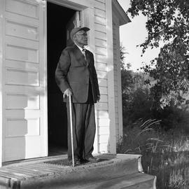 Photograph of an unidentified man with a cane